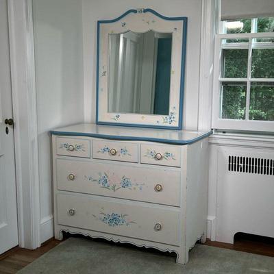 (2PC) WHITE PAINTED DRESSER & MIRROR | Small white dresser with painted floral details and a matching mirror (34 x 28 inches) (mirror is...