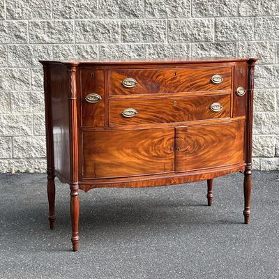 DUNCAN PHYFE STYLE SIDEBOARD | Flame mahogany veneer, turned and reeded carved supports. - l. 50 x w. 24 x h. 42 in
