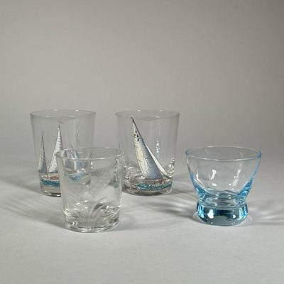 (4PC) MISC. GLASSES | Including two glasses painted with sailing ships, plus a glass with etched wheat decoration and one with blown...