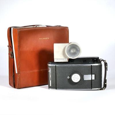 POLAROID LAND CAMERA | Polaroid Model 150 in leather carrying case with Polaroid Wink-Light flash mount, Type 47 3000 Speed Polaroid Land...