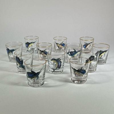 (12PC) ENAMEL DECORATED MARLIN GLASSES | Decorated with blown glass enamel painted marlins in high relief, gilt rims. - h. 3.25 x dia. 3 in 