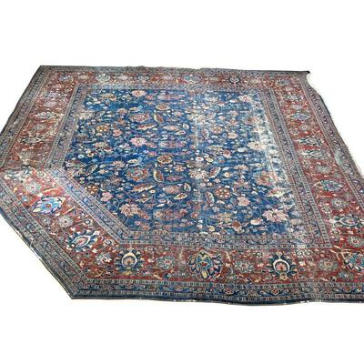 OVERALL PATTERN CARPET | Floral overall pattern on a blue ground within a red border, cut and rearranged to fit around a corner hearth. -...