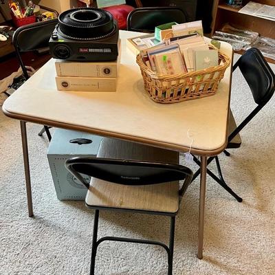 Vintage Samsonite black and grey folding chairs.