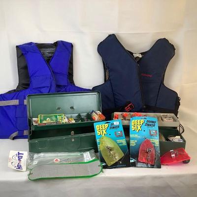 WIII358 Life Vests With Fish And Tackle	Lot includes: Â 2 Flotation Aid Vests - one still has the store tag. One vest is X-Large and the...