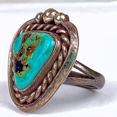 JUCR941 Signed Homer HiJoe Navajo Ring	Women's Navajo turquoise & sterling ring. Â Stamped HH for Homer HiJoe. Â Weighs approximately...