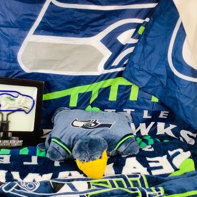 COCH328 Seahawks Memorabilia II	3 Blankets to warm yourself in the stands, 1 Neon Desk Lamp, 1 pillow and 1 Flag. Â The flag is...