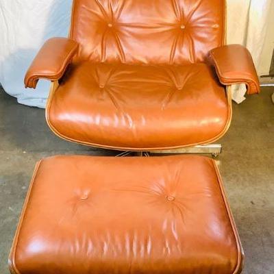 GRLE323 Charles Eames Leather Chair & Ottoman	Chair and Ottoman are made of chrome, leather and wood. Â There is a missing rivet at the...