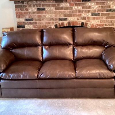 JETH956 Leather Couch	Brown leather sofa with attatched cushions and backs. Â No known defects.
