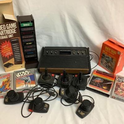 WIII805 Atari System With Games	Atari 2600 game system and an assortment of controllers and games. Includes three joysticks, two sets of...