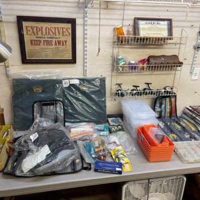Table full of old fishing gear lures 