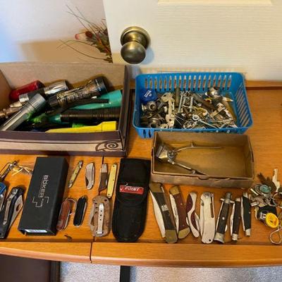selection of folding pocket knives 