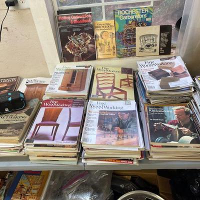 Table and boxes full of wood working magazines 