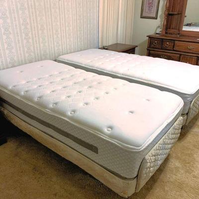 Matching twin size Sealy Posturpedic mattress lift beds
