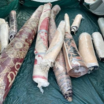 Over 20 mostly wool oriental rugs and runners all cleaned before wrapping 