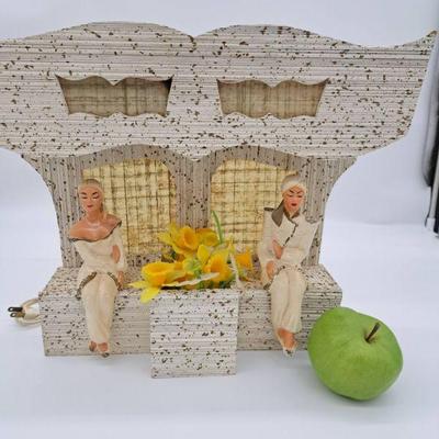 https://www.liveauctioneers.com/item/164540857_mcm-table-lamp-with-two-ladies-sitting-on-window-benches