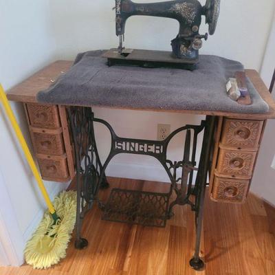 Antique sewing machine and cabinet