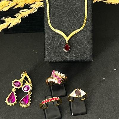 Lot of Gold Tone Fashion Jewelry with Red and Purple Stones - Rings, Earrings, & Necklace