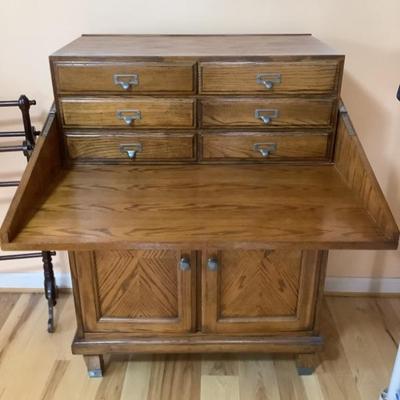 $110 flip-top secretary desk & storage 42"H 30"W16"depth -6 drawer and 2 door 