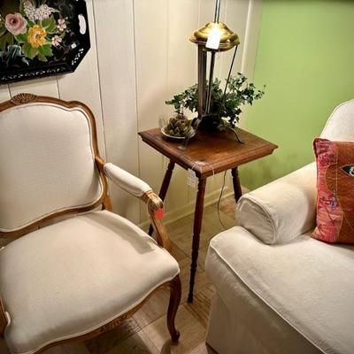 Wood frame chair upholstered in off white