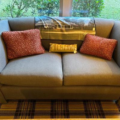 Tweed loveseat and sofa in golf room