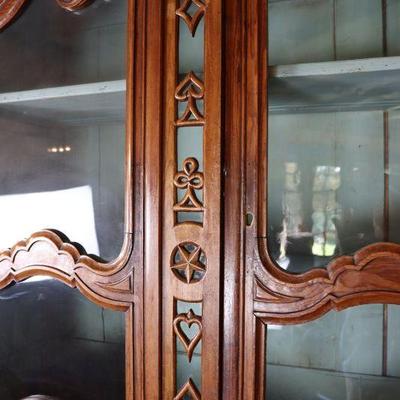Antique card-themed china cabinet