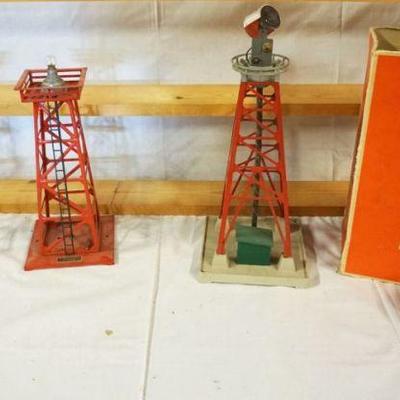 1058	LIONEL TRAIN LOT OF 2 BEACON, ONE MISSING TOP LENS & TOP WATER TANK
