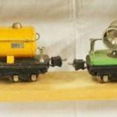 1045	LIONEL TRAIN LOT OF 4 CARS INCLUDING 812, 2815, 2820 & 2555
