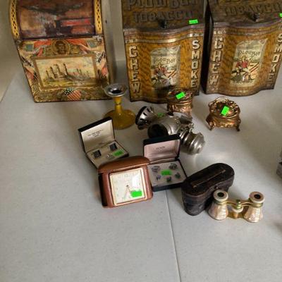Antique general store tins and costume jewelry. Uh oh! where did it go? It will be there the days of the sale