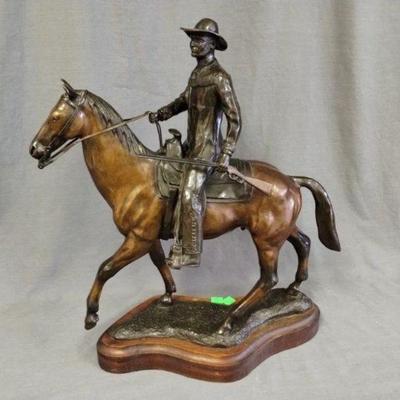 2000 Fred Hoppe bronze cowboy on horse statue on wood base, 20 in