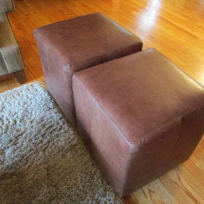 Precedent leather rolling seating ottomans