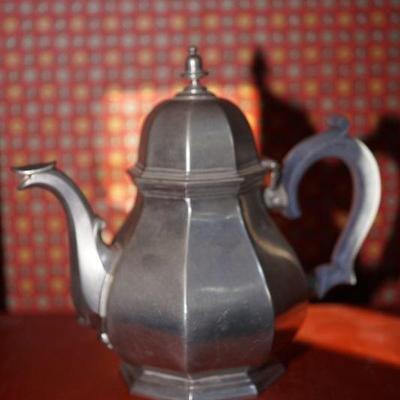 Many pieces of pewter.