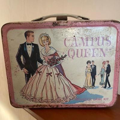 Vintage lunch box with thermos and toy