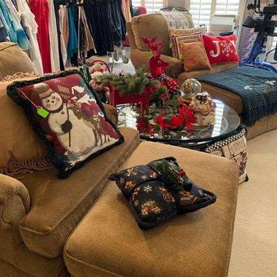Matching pair of stuffed chairs and ottomans, holiday pillows 