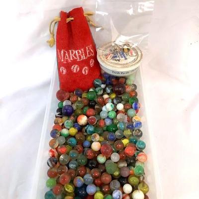 WIII207 Vintage/ Antique Marbles	All different sizes and colors, also comes with a old leather Marbles pouch.

