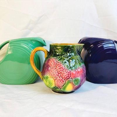 VIMY500 Fiesta And Salinas Les Bains Pitchers	Fruit colored Salins les Bains Pitcher. Retired Fiesta larger lilac colored pitcher as well...