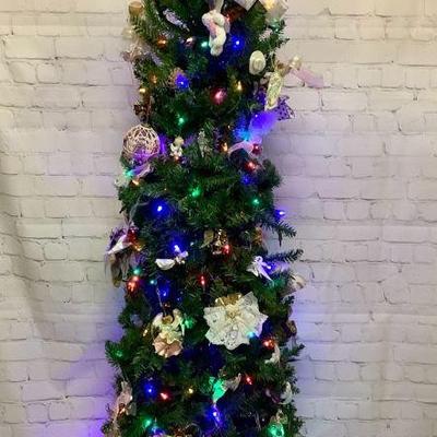 MAHA209 Christmas Tree With Ornaments #1	Approximately 6ft Christmas tree with a bunch of ornaments and has lights as well. Some of the...