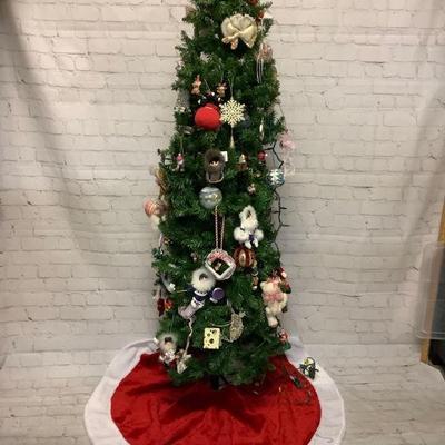 MAHA210 Christmas Tree With Ornaments #2	6ft tree that does come apart. Comes with a bunch of ornaments and tree skirt. Lights don't seam...