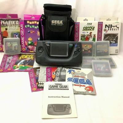 WIII230 Sega Game Gear & Games	Sega Portable video game console..For Parts ONLY..Does turn on but the screen is like a green...