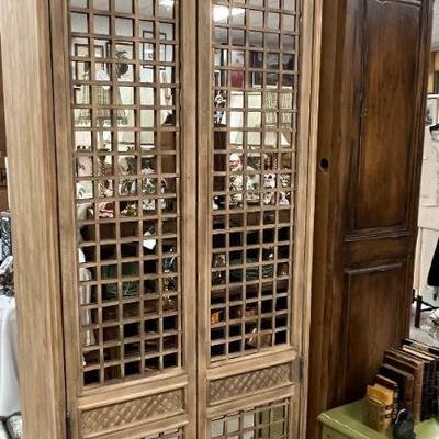 One of a PAIR of custom mirrored lattice cabinets