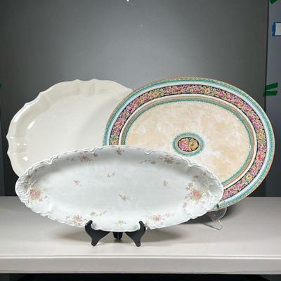 (3PC) LIMOGES & OTHER TRAYS | Porcelain serving trays, including an oval H & Co. L France Limoges tray, a large white serving platter,...