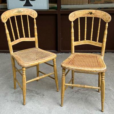 (2PC) PAIR PAINTED FANCY CHAIRS | Yellow paint with cane seats. - l. 18 x w. 16 x h. 34 in
