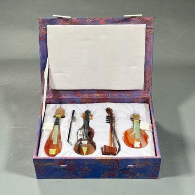 (4PC) CHINESE MINIATURE INSTRUMENTS | Jade and semi-precious stone/agate miniature instruments in a comforting box; longest 4.75 in. - l....