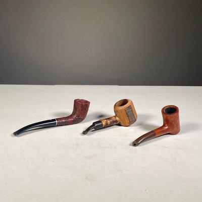(3PC) WOODEN PIPES | Including a French cherry wood pipe, a Burl pipe, and a knotty pipe. - l. 5.75 in (largest)
