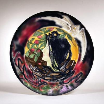 ART NOUVEAU MAJOLICA CHARGER | Showing the head of a woman crested by a dove, marked on the underside 