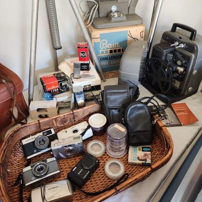 Cameras, movie and slide projectors
