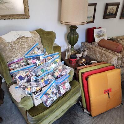 Vintage floor cushions, green velvet wingback chair