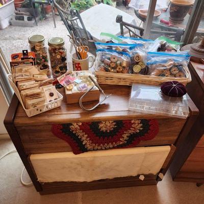 Lots of old buttons, wooden spools of thread