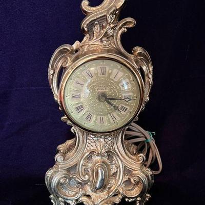Small brass Louis XV style mantle clock 