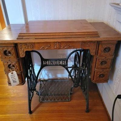 #1208 â€¢ Antique Singer Sewing Machine and Table.
