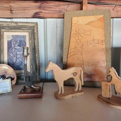 #10024 â€¢ Lot Of (2) Wooden Horse Statues, Porcelain Collector Plate, (2) Framed Art, Gun Lamp
